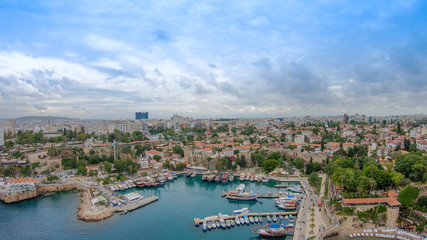 Fototapeta na wymiar View of the old Antalya from the height of the drone or bird's-eye view. This is the area of the old town and the old harbor.