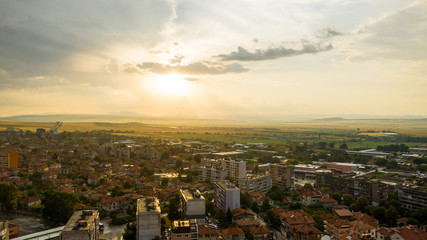 City skyline during storm at sunset.