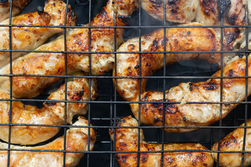 Grilled sausage on a barbecure, top view, close up