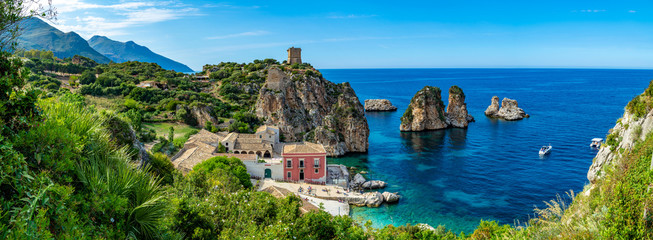 Coastline with rocks and deep blue sea near Castellamare del Golfo by entrance to natural reserve Zingaro, Sicily, Italy - obrazy, fototapety, plakaty