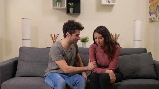 Reconciliation, apologies, love.young man tries to make peace with his sad wife