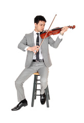 A full body image of young man playing the violin