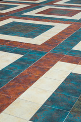 background of colored pavement tiles in the form of a geometric pattern