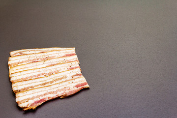 Slices of salted bacon with spices