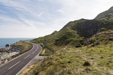Road by the sea on Causeway coastal route in county antrim, Northern Ireland