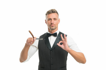 Excellent barber. Barber holding vintage barber tool. Man with razor retro barbershop. Hipster with...