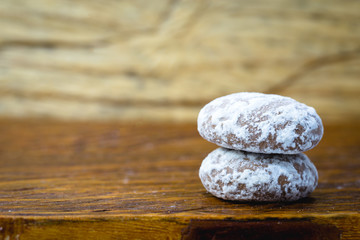 Honey bread, typical Brazilian honey biscuit with sugar and chocolate. Brazilian honey cake with chocolate - honey bread on wooden background. Selective focus. Copy space