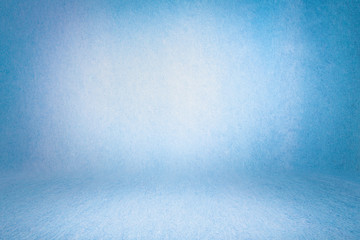 blue photo backdrop wall and floor lit by lamps, studio background for photos. Studio Portrait...