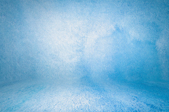 blue photo backdrop wall and floor lit by lamps, studio background for photos. Studio Portrait Backdrops Photo