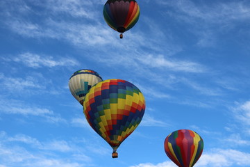 Several Hot Air Balloons with cyrus clouds