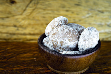 Homemade biscuit typical of Brazil, bakery biscuit with sugar and chocolate. Brazilian honey cake with chocolate - honey bread on wooden background. Selective focus. Copy space
