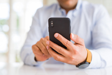 Close up of business man hands using smarpthone