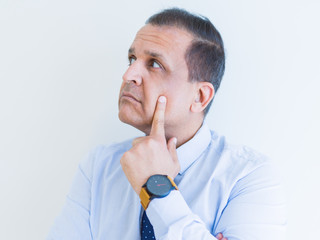 Middle age man thinking clueless about a question