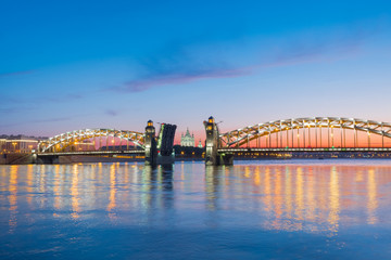 View of the Smolny Cathedral and the divorced Bolsheokhtinsky bridge during the white nights in June. St. Petersburg. Russia