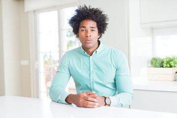 African American business man wearing elegant shirt skeptic and nervous, frowning upset because of problem. Negative person.