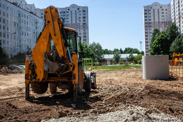 Obraz premium Special equipment at the construction site. Home construction . Concrete ring. Heavy machinery. Powered by diesel.