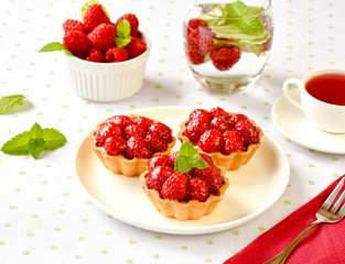 Homemade mini tarts with raspberries fruits