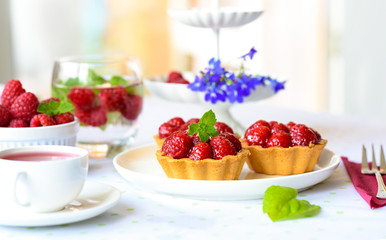 Homemade mini tarts with raspberries fruits