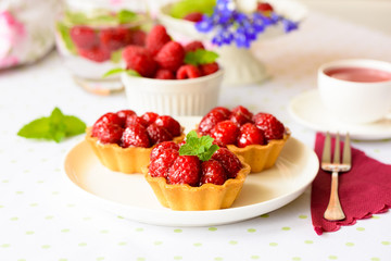 Homemade mini tarts with raspberries fruits