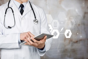 Close-up Doctor at hospital working with tablet pc