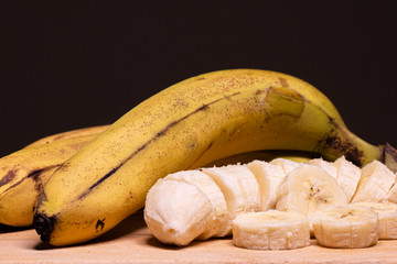 ripe bananas on wooden top