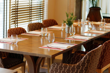 casual restaurant dining table set up, with dark brown color theam