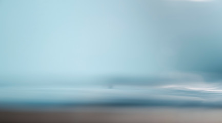 Fototapeta premium Blurred beach with bokeh sunlight wave abstract background. Vintage tone