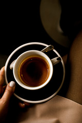 Woman hand holding espresso coffee