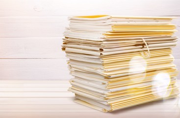 File folders with documents isolated on white background