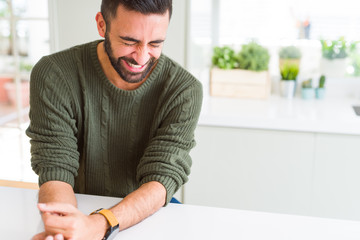 Fototapeta premium Handsome man smiling cheerful with a big smile on face showing teeth, positive and happy expression