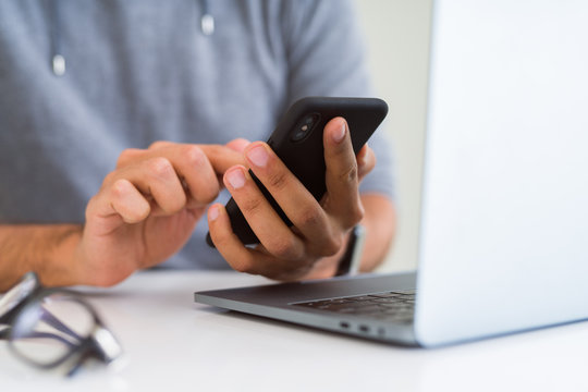 Close up of man using smartphone