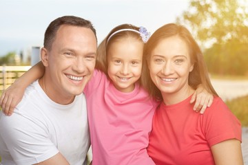 Happy cheerful family on background