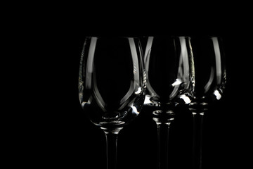 Set of empty glasses on black background