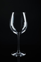 New empty wine glass on black background