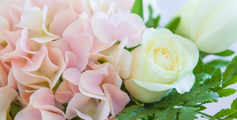 Wedding flowers, wedding bouquet close-up. Ornaments from roses and ornamental plants, on a postcard