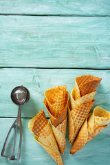 waffle cones on turquoise wooden surface