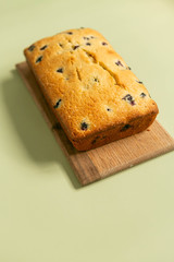 Close Up of Lemon Blueberry Loaf Cake, Pale Green Background, Side View