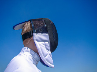 Mask with mesh swordsman and jacket (jerkin) on the mannequin. Background blue sky. Close-up....