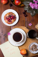 Fototapeta na wymiar happy morning . life style shot with coffee, berry cake and fruits