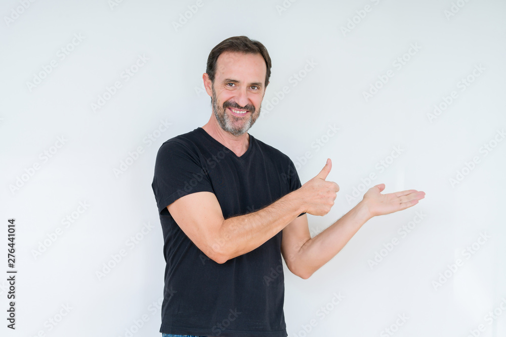 Poster Senior man over isolated background Showing palm hand and doing ok gesture with thumbs up, smiling happy and cheerful