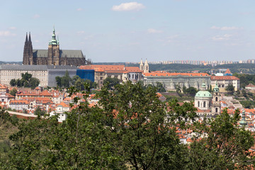 Obraz premium Summer Prague City with gothic Castle and the green Nature from the Hill Petrin, Czech Republic