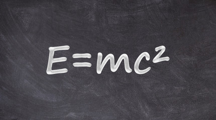 Einstein relativity equation written on blackboard