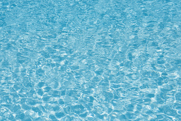 Blue water in pool for background and abstract, Ripple wave with sun reflection in swimming pool