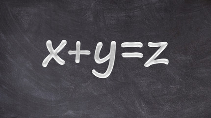 X plus Y equals Z written on blackboard