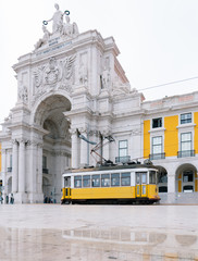 Yellow Cable Car in Commerce Square, Lisbon, Portugal