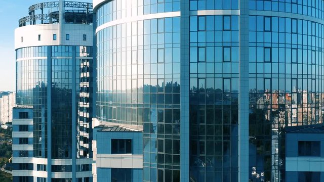 Aerial elevator shot of modern glassed skyscraper exterior
