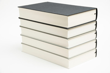 A Set Of Neatly Stacked Monochromatic Cloth Bound Books