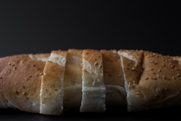 sliced fresh bread on back background