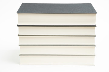 A Set Of Neatly Stacked Monochromatic Cloth Bound Books