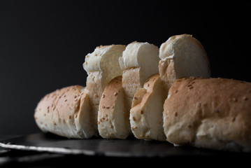 sliced fresh bread on back background